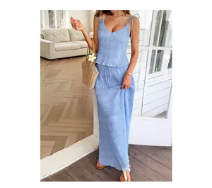 Detail shot of the crinkle texture fabric on light blue crop top and matching maxi skirt set