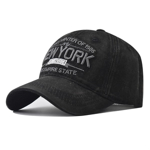 Detail of vintage washed black cotton baseball cap featuring 3D New York embroidery