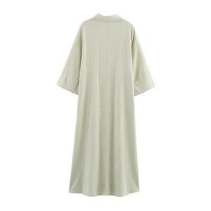 Back view of a loose linen shirt dress in light green with three-quarter sleeves