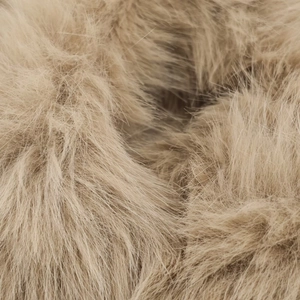 Detailed close-up of soft khaki long-pile faux fur texture on a fashion short jacket