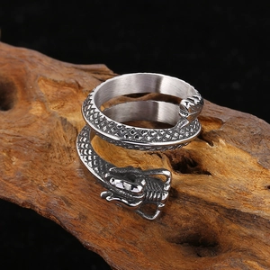 Detailed macro view of vintage dragon ring showing intricate metal scales and textures