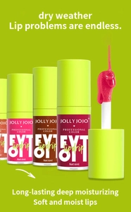Macro shot of hydrating lip oil texture and soft applicator brush for glossy finish