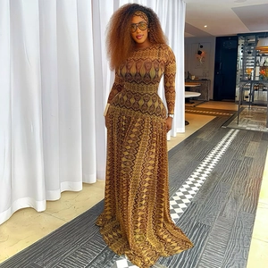 Elegant long sleeve dress with geometric print and matching headscarf in earth tones