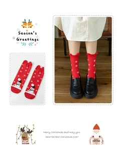 Detail of red Christmas socks with snowman and snowflake patterns for holiday season