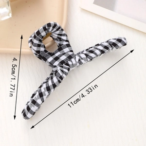 Detail view of black and white checkered fabric hair claw clip with size measurements