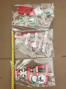 Three-piece wooden Christmas ornament set featuring Santa, snowmen, and gnomes motifs