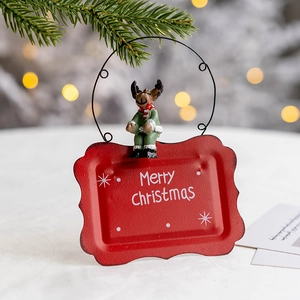 Christmas reindeer welcome sign with Merry Christmas text on red metal hanging plate