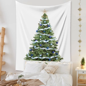 Close-up of bohemian Christmas tree tapestry hanging on bedroom wall with warm string lights