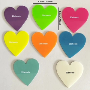 Set of eight colorful heart-shaped sticky notes in a flat lay matrix for office use