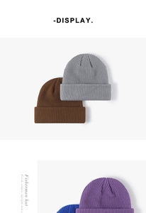 Detailed knit texture of thick winter fisherman hats in various colors for cold weather
