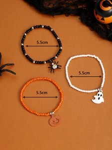 Three-piece Halloween beaded bracelet set with spider, ghost and pumpkin charms