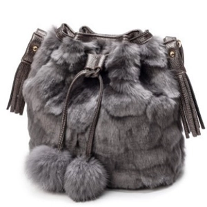 Gray faux fur bucket bag featuring plush pom-poms and elegant tassel charms on white background
