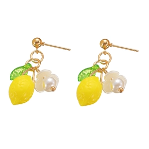 Close-up of summer lemon drop earrings with resin fruit, green leaves, and white flowers