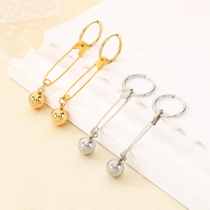 Detail of safety pin hoop earrings with polished beads in gold and silver finishes