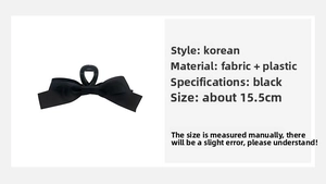 Detail view of large 15.5cm black satin bow hair claw clip showing size and dimensions