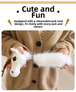 Detail showing the retractable drawstring on this white plush horse head bag charm