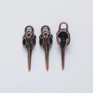 Vintage bronze bird skull alloy pendants for DIY jewelry making, showing front and back views