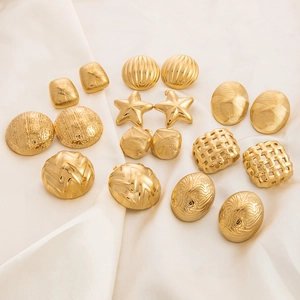 Collection of vintage gold plated stainless steel earrings with star and textured designs