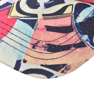 Detail of baseball cap brim with colorful graffiti print and reinforced stitching lines