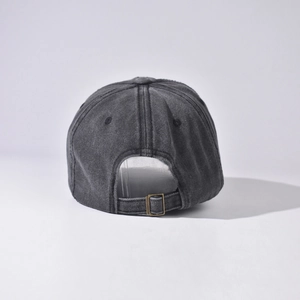Detail of vintage washed baseball cap back with bronze buckle and worn texture