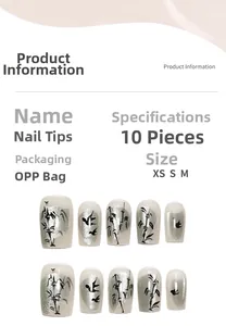 Detailed view of cat eye press-on nails set with ink bamboo and bird patterns