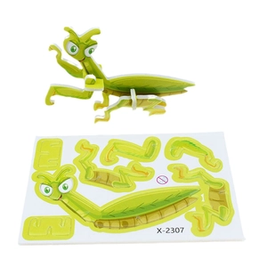 Detail of 3D insect puzzle showing green mantis model and pre-cut DIY cardboard parts