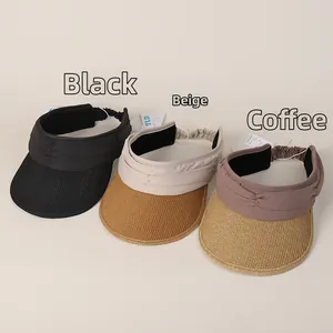 Detail of pleated fabric headband and woven straw brim on sun visor in various colors