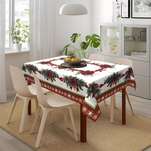 Detailed Christmas tablecloth with red poinsettia floral patterns in a cozy dining setting