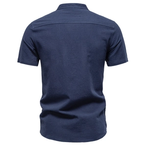 Detail view of navy blue cotton linen short sleeve shirt back showing fabric texture