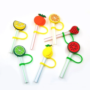 Macro view of six colorful silicone fruit straw toppers including lemon and strawberry