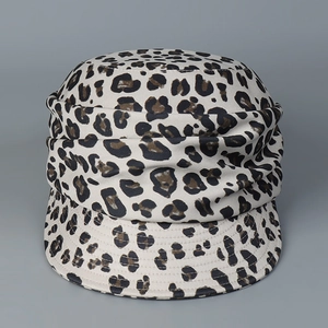 Detailed view of leopard print octagonal hat with textured folds and sturdy short brim