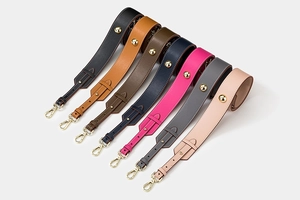 Detailed set of leather shoulder straps with gold metal clasps in seven assorted colors