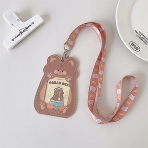 Detail of a brown PU leather bear-shaped ID card holder with matching character lanyard
