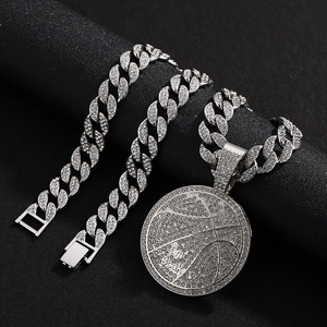 Detail of silver Cuban chain set with iced out basketball pendant engraved I'm Back