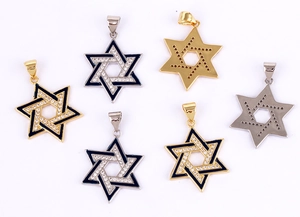 Detailed view of Star of David pendants in gold and silver with enamel and diamonds