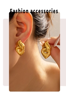 Detail shot of chunky double hoop earrings in 18k gold plated stainless steel