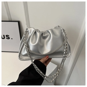 Close-up of silver pleated crossbody bag with pebble grain leather and chain strap