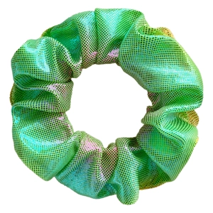 Close-up of green metallic laser fabric scrunchie with detailed dot texture and soft folds