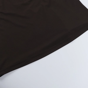 Close-up of the double-needle stitching on the hem of a black mesh halter dress