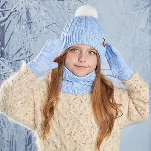 Kids winter knit set with pom-pom beanie, scarf, and gloves in blue cable knit style
