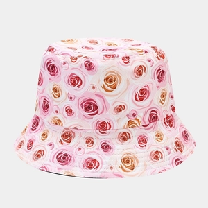 Detail of the rose floral pattern and durable stitching on the cotton bucket hat