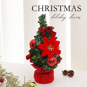 Mini 20cm tabletop Christmas tree with red poinsettia and velvet bows on woven base