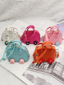 Mini car-shaped coin purses in five vibrant colors with textured PU leather and gold zippers