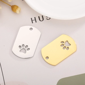 Polished stainless steel pet ID tags with hollow paw prints in gold and silver colors