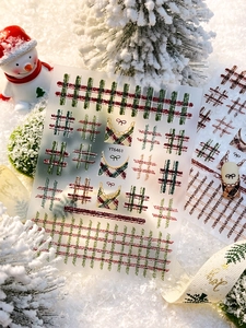 Detailed view of YT6461 Christmas nail stickers with vintage plaid and bow patterns