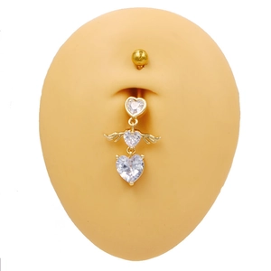 Golden heart-shaped navel piercing with three clear zircons and angel wings design