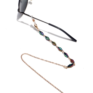Detail of colorful faceted crystal beads and gold metal chain for eyewear strap