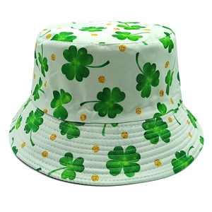 Close-up of St. Patrick's Day bucket hat with green shamrocks and gold glitter dots