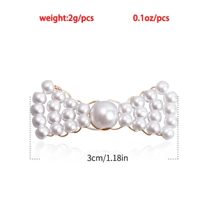 Detail view of handmade pearl woven bow earring showing size 3cm and weight 2g specs