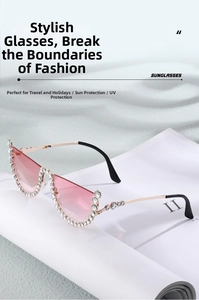 Detailed view of cat-eye rimless sunglasses with rhinestones and pink gradient lenses